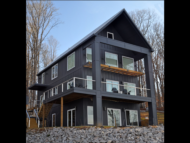 Modern dark lake house with stacked decks in Littleton, North Carolina