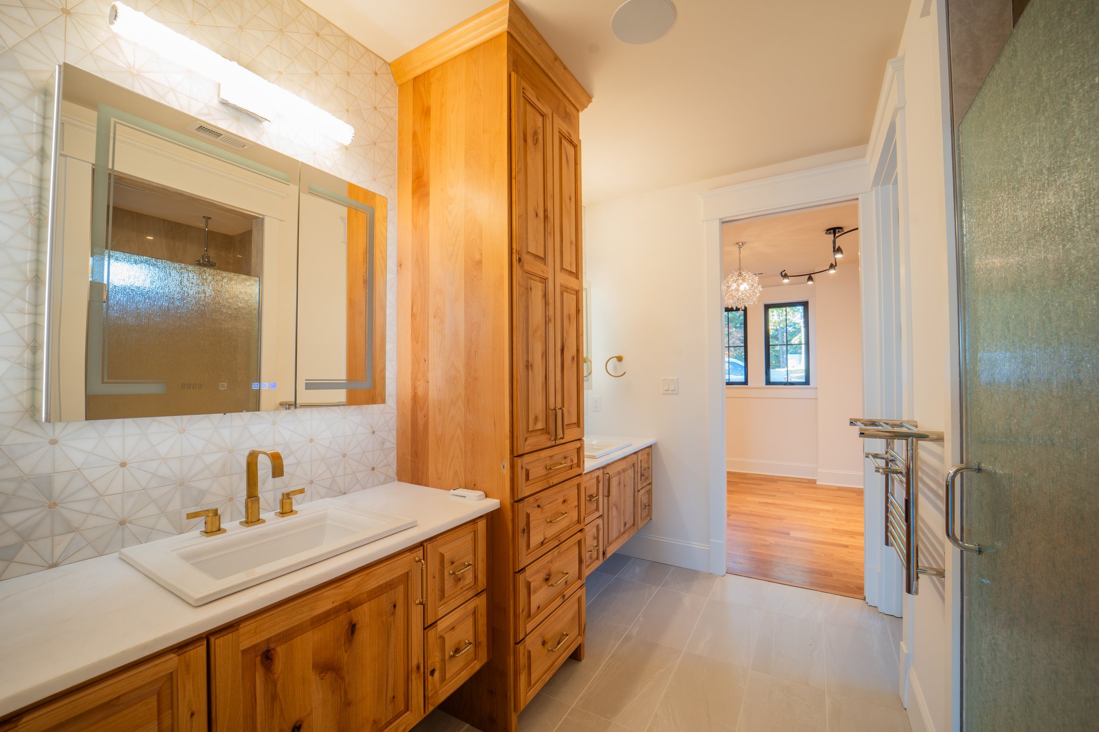 House on the lake bath with knotty pine vanity and brass fittings